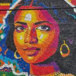 El venezolano Óscar Olivares culminó en El Salvador el mural de tapas plásticas más alto del mundo